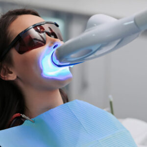women getting her teeth whitened at a dentist