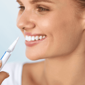Women applying her teeth, teeth whitenin pen.